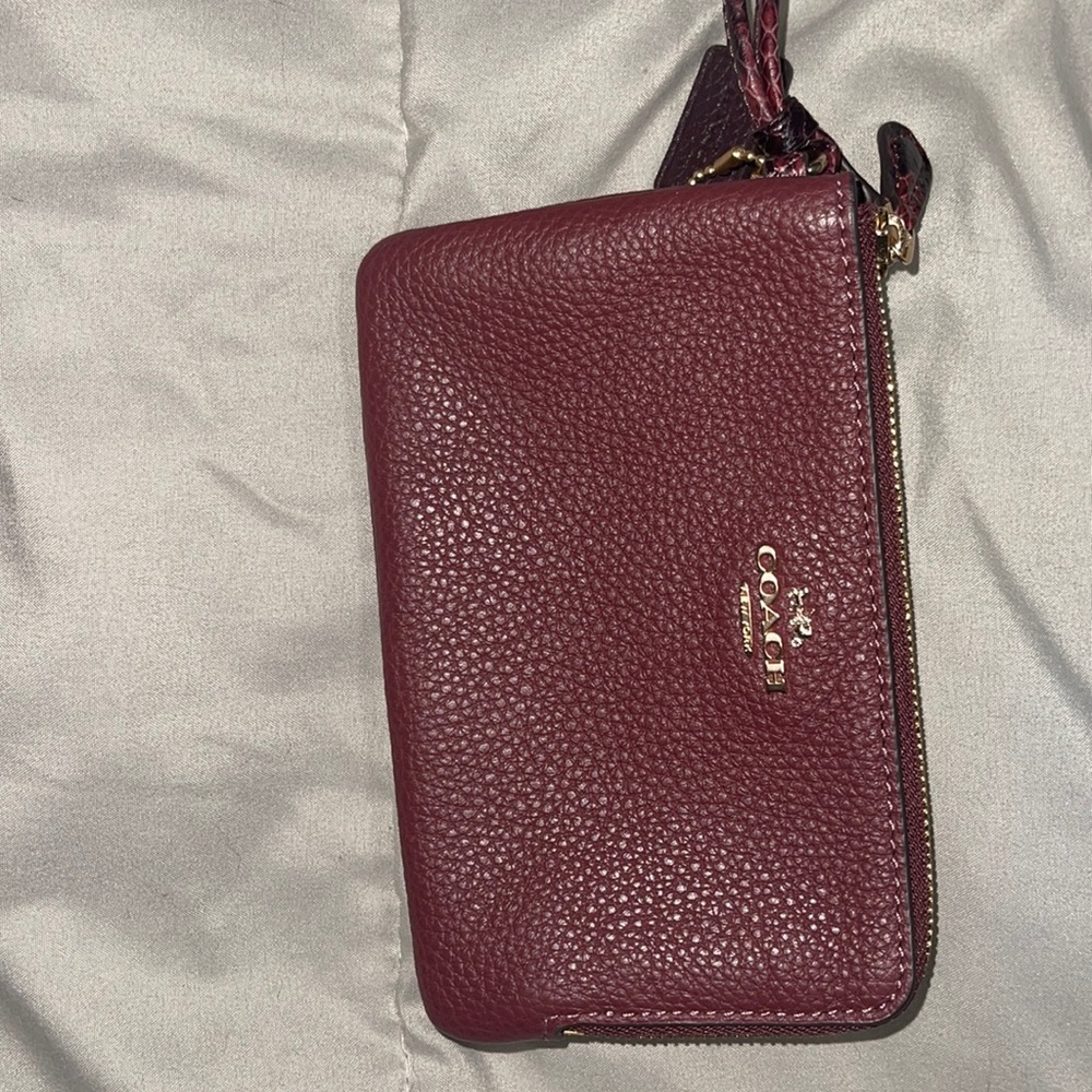 Maroon coach wristlet never used in brand new condition